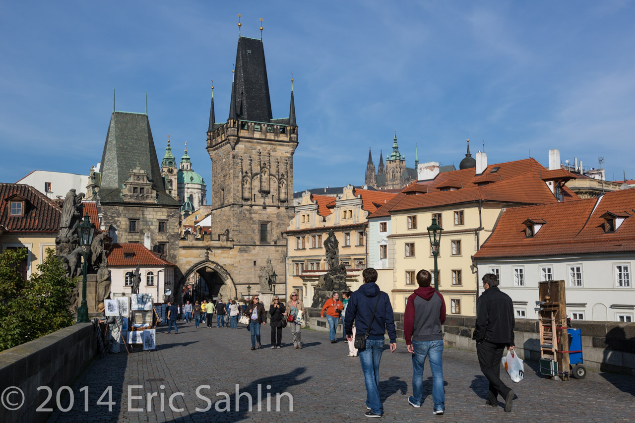 Both sides of the Bridge have towers. Prague Castle is in the background